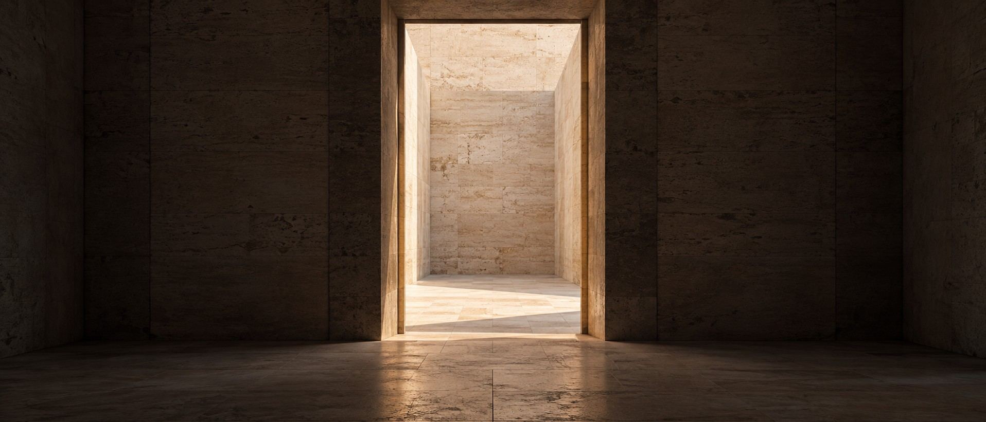 A centered stone doorway opening onto a sunlit courtyard